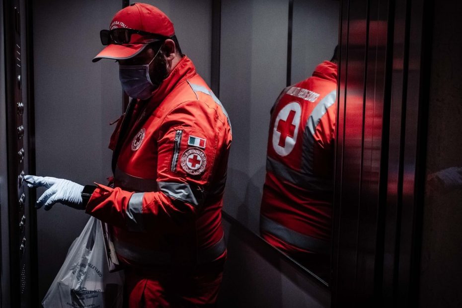 Red Cross paramedic inside an elevator in the UK.